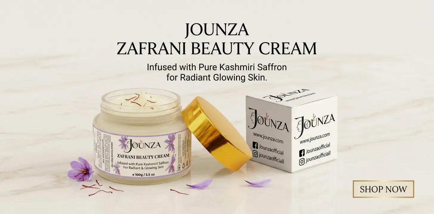 Jounza Zafrani Beauty Cream homepage banner featuring an open 100g product jar topped with real saffron strands next to its premium white and gold packaging box. Text reads: Jounza Zafrani Beauty Cream, Infused with Pure Kashmiri Saffron for Radiant Glowing Skin.
